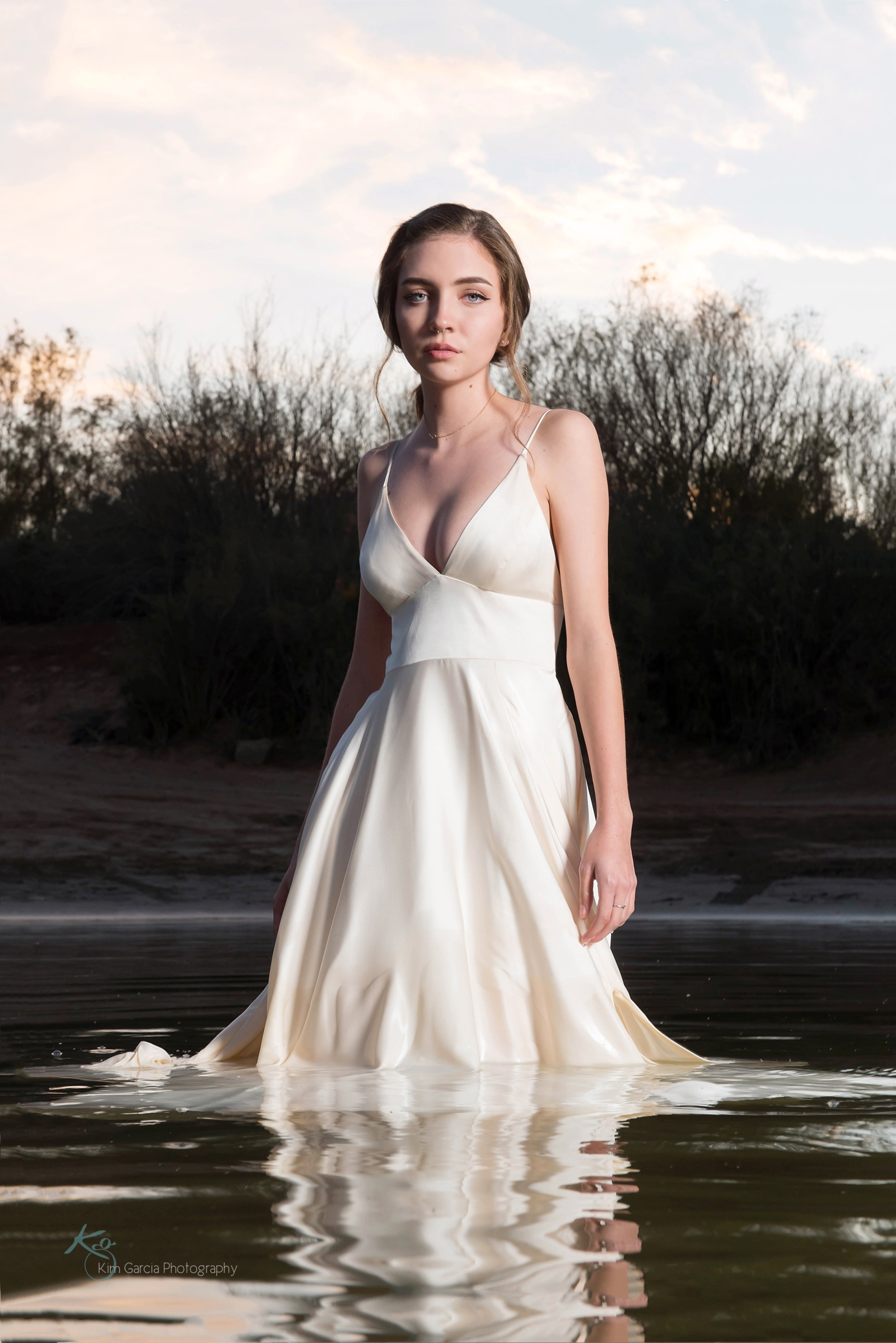 Yuma Arizona senior photo of girl in water in white dress senior portrait idea