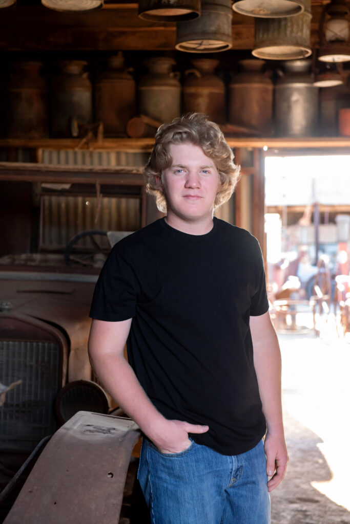 Outdoor boy senior pictures with vintage cars in Yuma, Arizona 